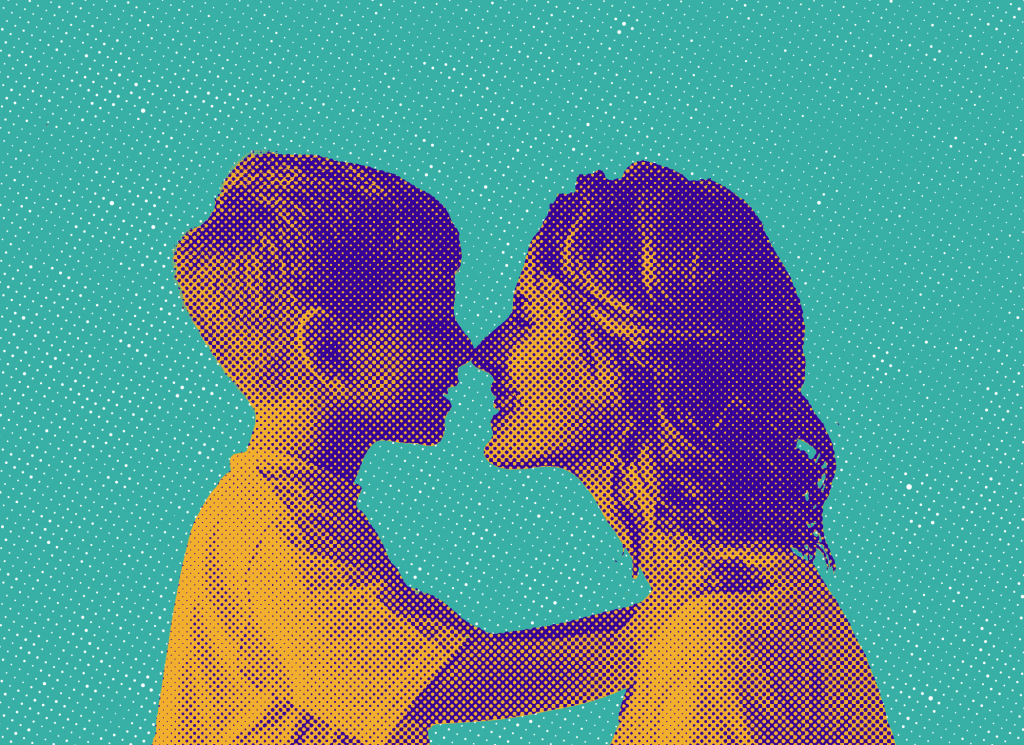 A happy young boy and his mother, touching noses and smiling