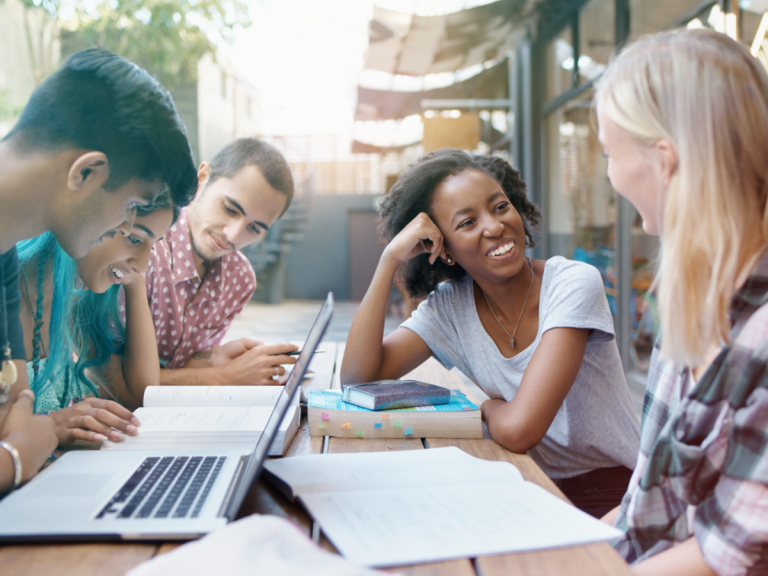 Group of diverse students studying together